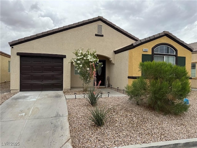 ranch-style house featuring an attached garage, stucco siding, and driveway