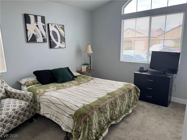 bedroom featuring light carpet and vaulted ceiling