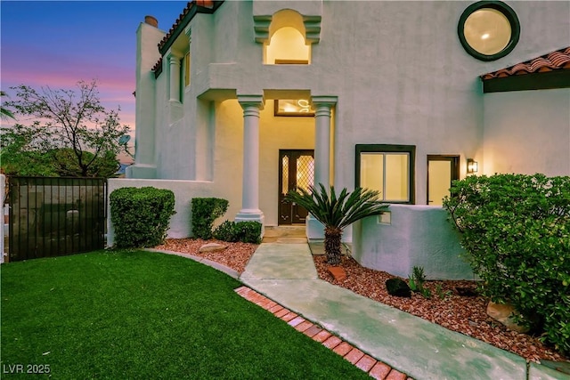 2589 Sun Reef Rd, Las Vegas, NV 89128 - view of front facade featuring stucco siding and a yard
