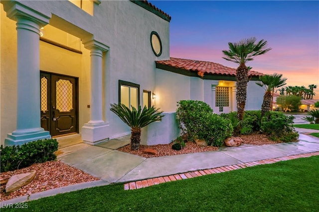 2589 Sun Reef Rd, Las Vegas, NV 89128 - view of front of property with a tiled roof and stucco siding