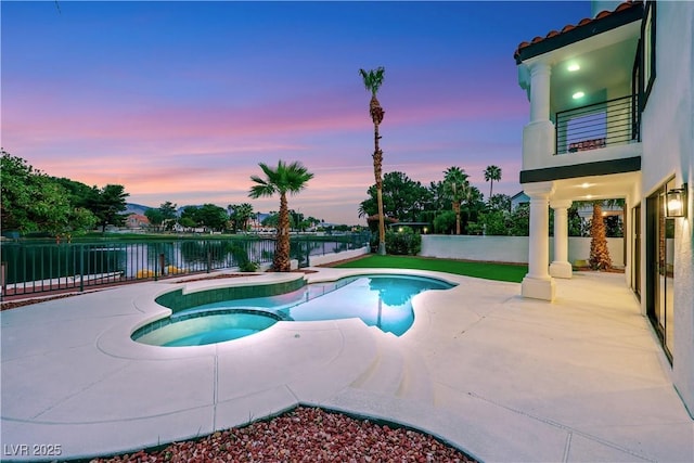 2589 Sun Reef Rd, Las Vegas, NV 89128 - view of swimming pool with a water view, a patio, a pool with connected hot tub, and a fenced backyard
