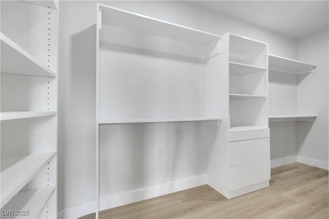 2589 Sun Reef Rd, Las Vegas, NV 89128 - walk in closet featuring light wood-style flooring