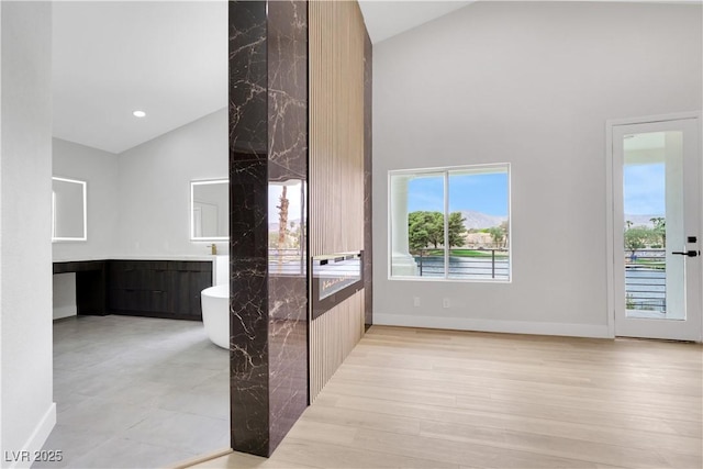 2589 Sun Reef Rd, Las Vegas, NV 89128 - bathroom with high vaulted ceiling, a freestanding tub, and vanity