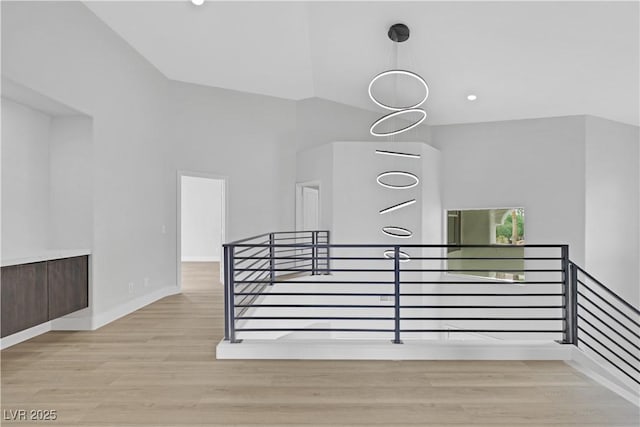 2589 Sun Reef Rd, Las Vegas, NV 89128 - stairs featuring wood finished floors and vaulted ceiling