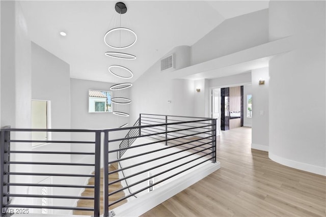 2589 Sun Reef Rd, Las Vegas, NV 89128 - staircase with wood finished floors and high vaulted ceiling