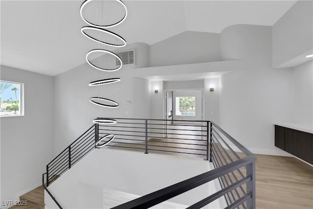 2589 Sun Reef Rd, Las Vegas, NV 89128 - staircase featuring wood finished floors and baseboards