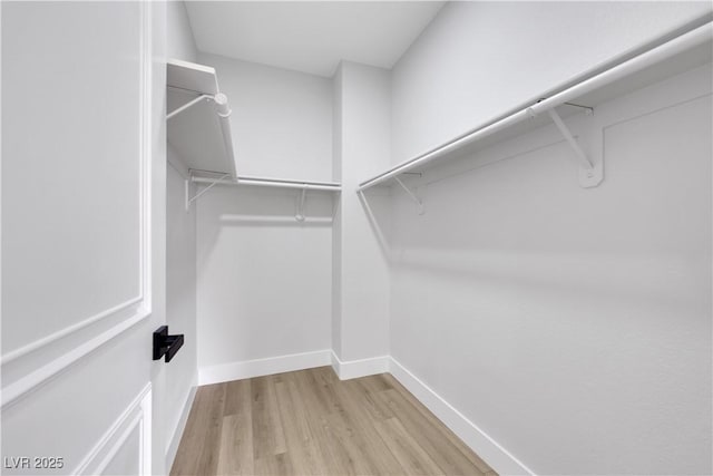 2589 Sun Reef Rd, Las Vegas, NV 89128 - spacious closet with wood finished floors
