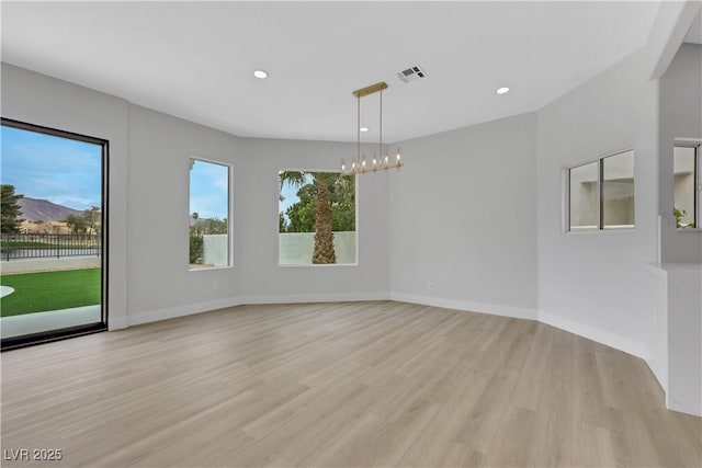 2589 Sun Reef Rd, Las Vegas, NV 89128 - spare room featuring light wood-style flooring, recessed lighting, and a chandelier