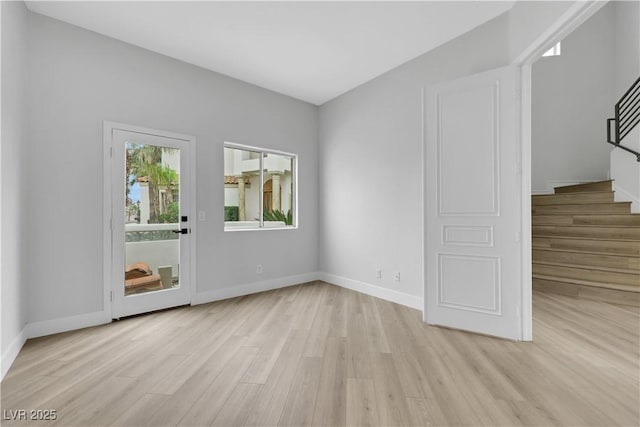 2589 Sun Reef Rd, Las Vegas, NV 89128 - empty room with light wood finished floors and stairway
