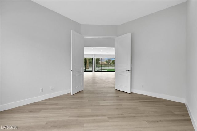 2589 Sun Reef Rd, Las Vegas, NV 89128 - empty room with baseboards and light wood-style floors