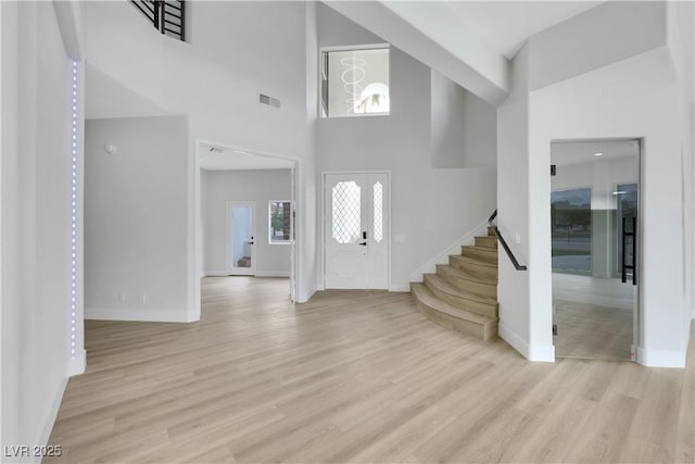 2589 Sun Reef Rd, Las Vegas, NV 89128 - foyer with stairway, light wood-style flooring, and a towering ceiling