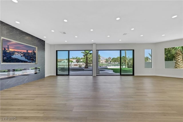2589 Sun Reef Rd, Las Vegas, NV 89128 - unfurnished living room with recessed lighting and wood finished floors