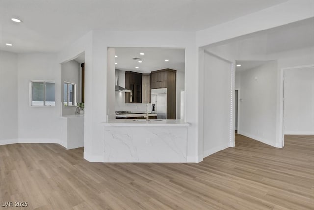 2589 Sun Reef Rd, Las Vegas, NV 89128 - unfurnished living room with light wood-style floors and recessed lighting