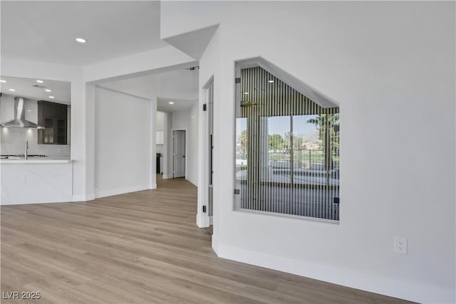 2589 Sun Reef Rd, Las Vegas, NV 89128 - unfurnished living room with light wood-style flooring and recessed lighting
