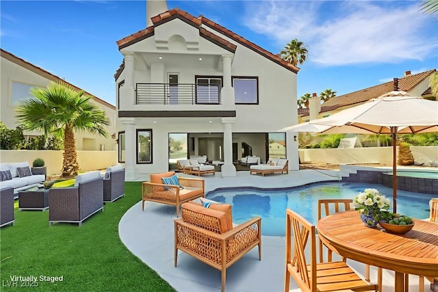 2589 Sun Reef Rd, Las Vegas, NV 89128 - back of house featuring a balcony, an outdoor living space, a patio area, and stucco siding