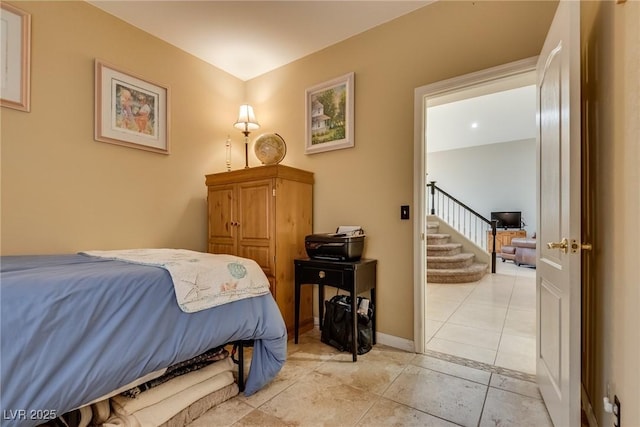 bedroom featuring light tile patterned floors