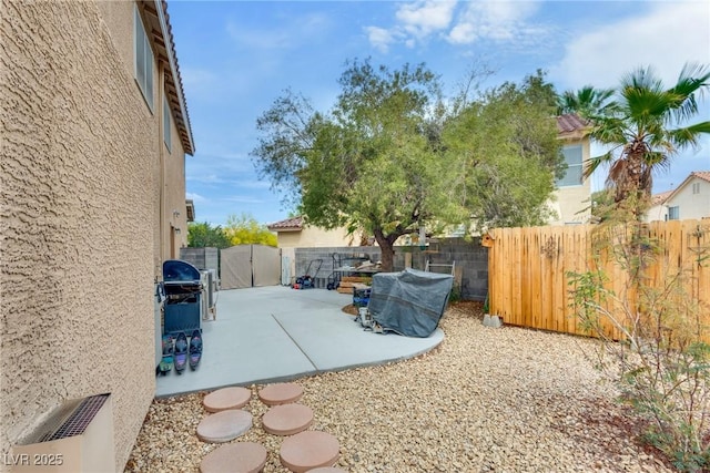 view of patio / terrace with a fenced backyard and a gate