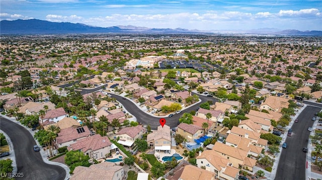 birds eye view of property featuring a mountain view and a residential view