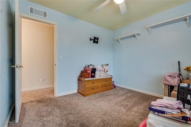 carpeted bedroom with baseboards, a ceiling fan, and visible vents