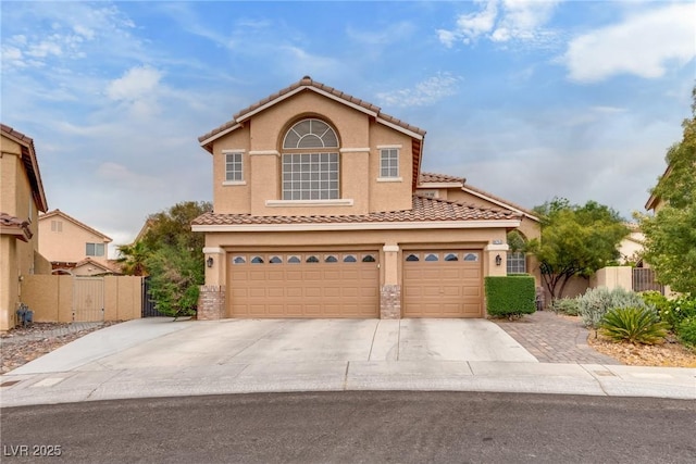 view of front facade featuring a gate, a garage, stucco siding, fence, and concrete driveway