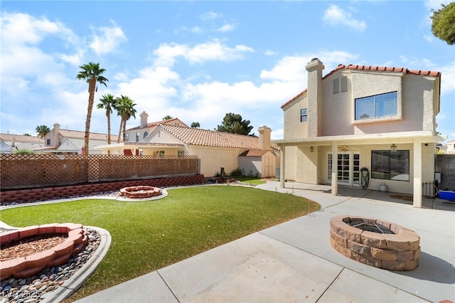 2046 Waverly Cir, Henderson, NV 89014 - view of yard featuring an outdoor fire pit, a patio area, a storage shed, and an outbuilding