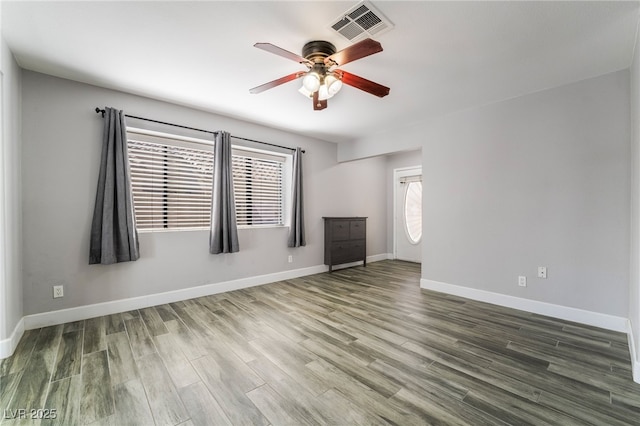 2046 Waverly Cir, Henderson, NV 89014 - spare room featuring ceiling fan, wood finished floors, and baseboards