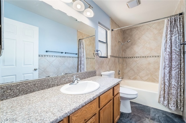 2046 Waverly Cir, Henderson, NV 89014 - bathroom featuring toilet, shower / bath combo, vanity, and tile walls