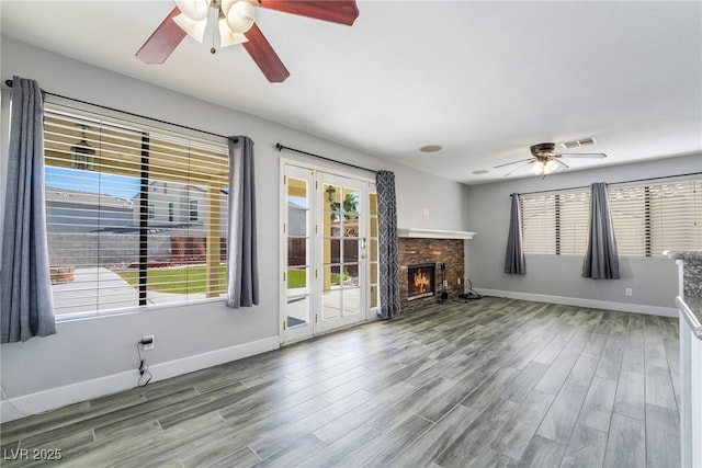 2046 Waverly Cir, Henderson, NV 89014 - unfurnished living room with ceiling fan, baseboards, and wood finished floors