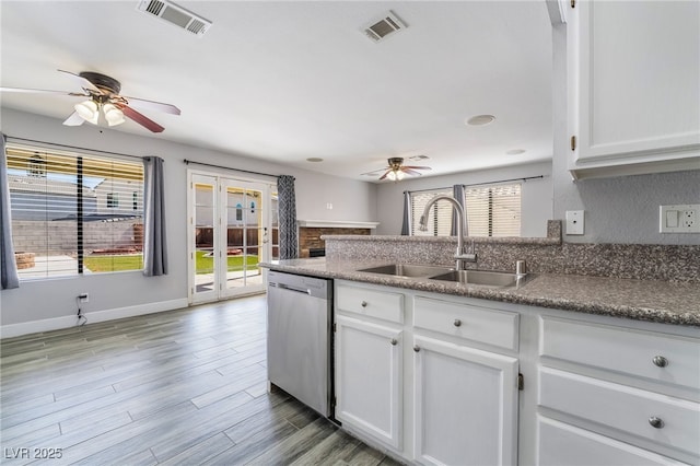 2046 Waverly Cir, Henderson, NV 89014 - kitchen featuring ceiling fan, dishwasher, a sink, and white cabinetry