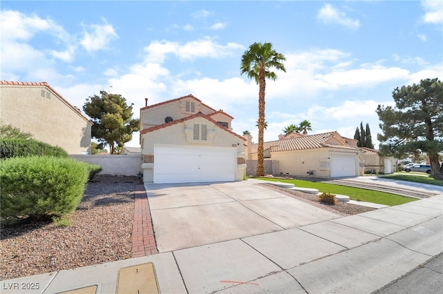 2046 Waverly Cir, Henderson, NV 89014 - mediterranean / spanish-style house featuring driveway, stucco siding, and fence