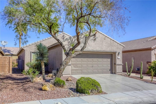 4124 Gliding Gulls Ave, North Las Vegas, NV 89084 - view of front of house with a garage, driveway, a tiled roof, and stucco siding