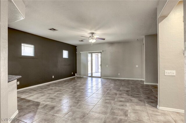 4124 Gliding Gulls Ave, North Las Vegas, NV 89084 - unfurnished room with ceiling fan, light tile patterned floors, and baseboards