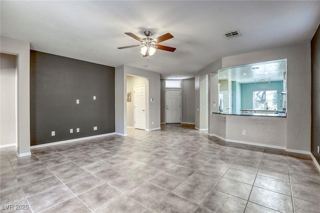 4124 Gliding Gulls Ave, North Las Vegas, NV 89084 - unfurnished living room featuring ceiling fan, tile patterned flooring, and baseboards