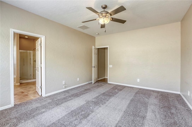 4124 Gliding Gulls Ave, North Las Vegas, NV 89084 - unfurnished bedroom featuring carpet flooring, baseboards, ceiling fan, and ensuite bathroom