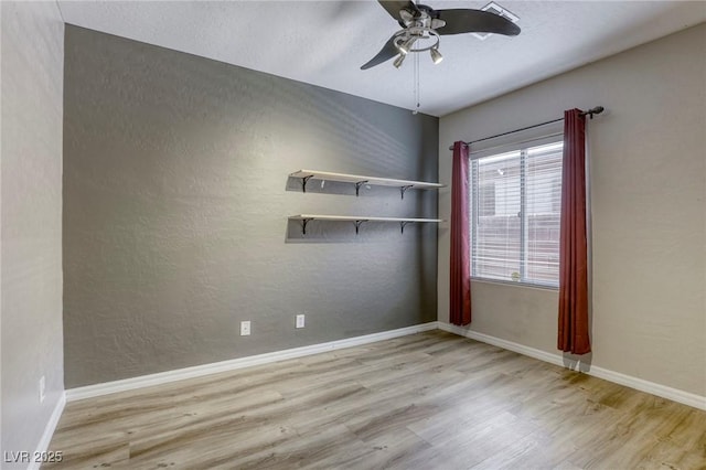4124 Gliding Gulls Ave, North Las Vegas, NV 89084 - spare room featuring wood finished floors, a ceiling fan, and baseboards