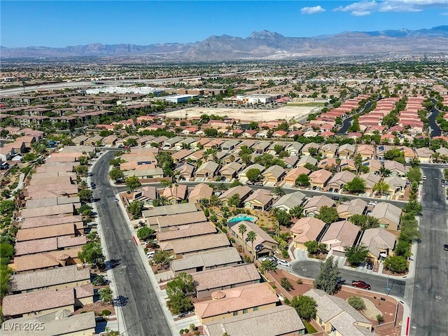4124 Gliding Gulls Ave, North Las Vegas, NV 89084 - aerial perspective of suburban area featuring a mountainous background