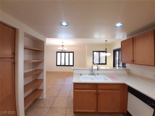9580 W Reno Ave Unit 183, Las Vegas, NV 89148 - kitchen featuring white dishwasher, a notable chandelier, light tile patterned floors, a sink, and a peninsula