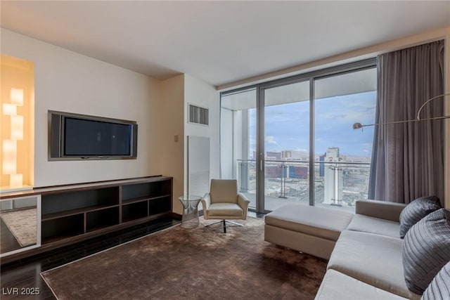 4381 W Flamingo Rd Unit 3818, Las Vegas, NV 89103 - living area with expansive windows, visible vents, and wood finished floors