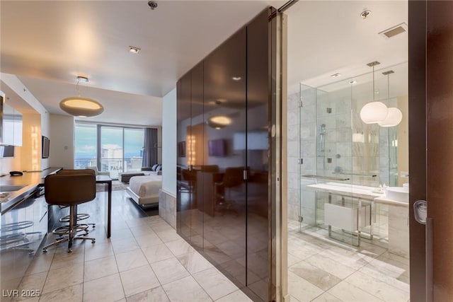 4381 W Flamingo Rd Unit 3818, Las Vegas, NV 89103 - bathroom with tile patterned floors and a shower with shower door