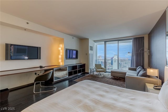 4381 W Flamingo Rd Unit 3818, Las Vegas, NV 89103 - bedroom featuring floor to ceiling windows, wood finished floors, and access to exterior