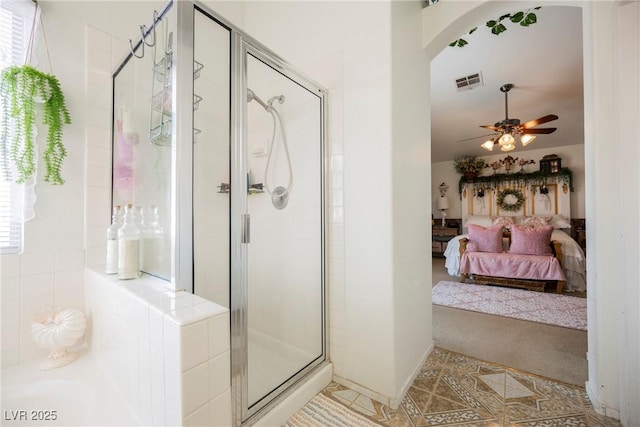 ensuite bathroom with a stall shower, ceiling fan, connected bathroom, and visible vents