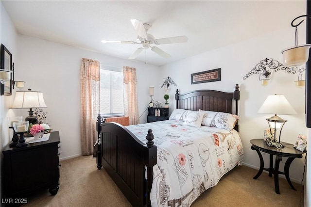 bedroom featuring baseboards, ceiling fan, and carpet floors