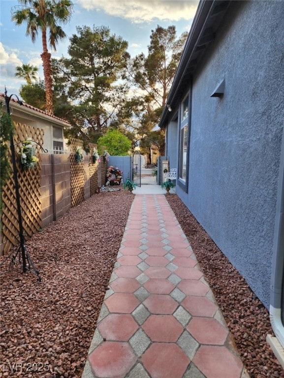 view of yard featuring fence private yard and a gate