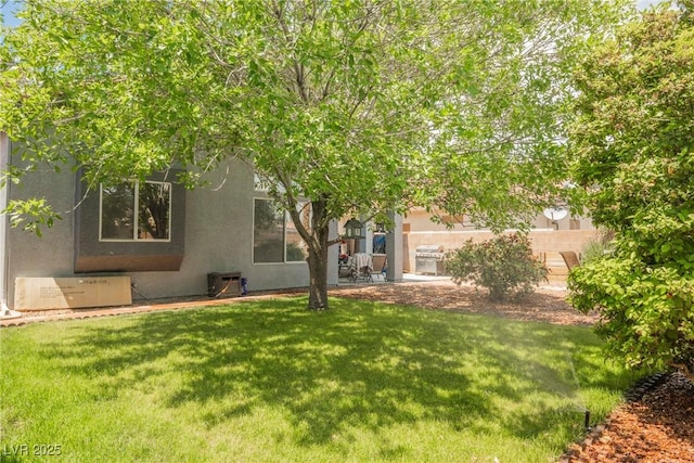 exterior space featuring a lawn and stucco siding