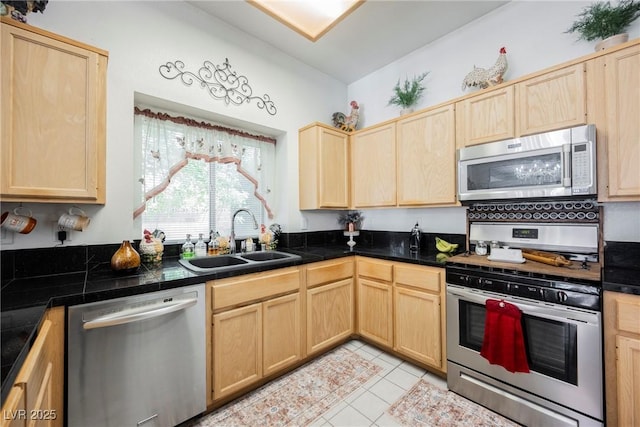 kitchen featuring appliances with stainless steel finishes and light brown cabinetry
