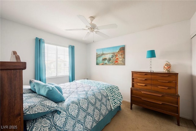 bedroom with a ceiling fan and carpet floors