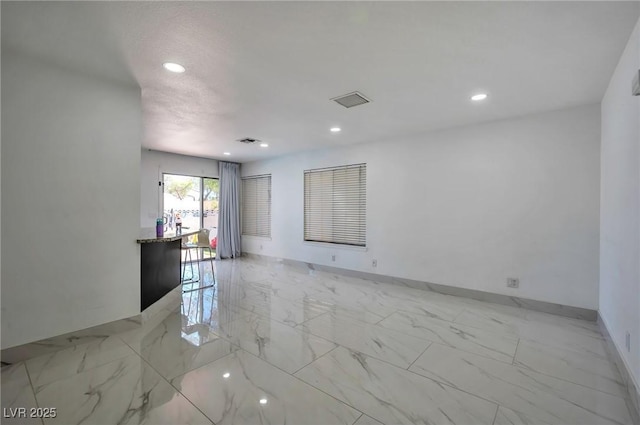 8404 Shore Breeze Dr, Las Vegas, NV 89128 - empty room with light marble finish floors, recessed lighting, and baseboards