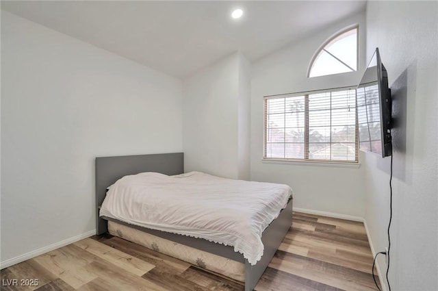 8404 Shore Breeze Dr, Las Vegas, NV 89128 - bedroom featuring multiple windows, wood finished floors, baseboards, lofted ceiling, and recessed lighting