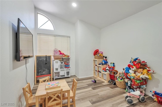 8404 Shore Breeze Dr, Las Vegas, NV 89128 - rec room with wood finished floors, baseboards, and lofted ceiling