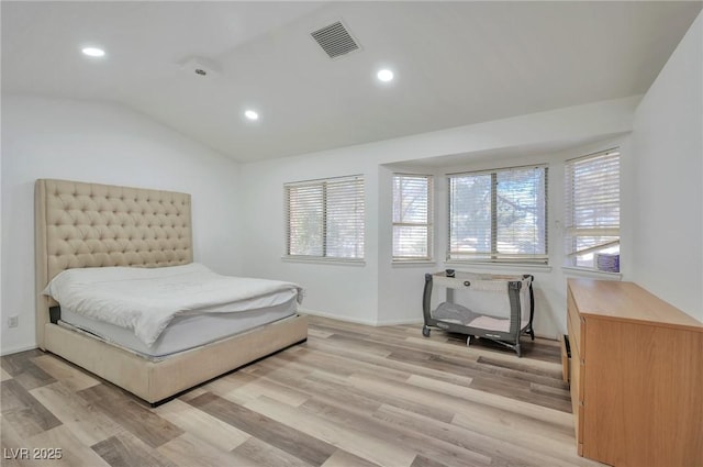 8404 Shore Breeze Dr, Las Vegas, NV 89128 - bedroom featuring light wood-type flooring, visible vents, and multiple windows